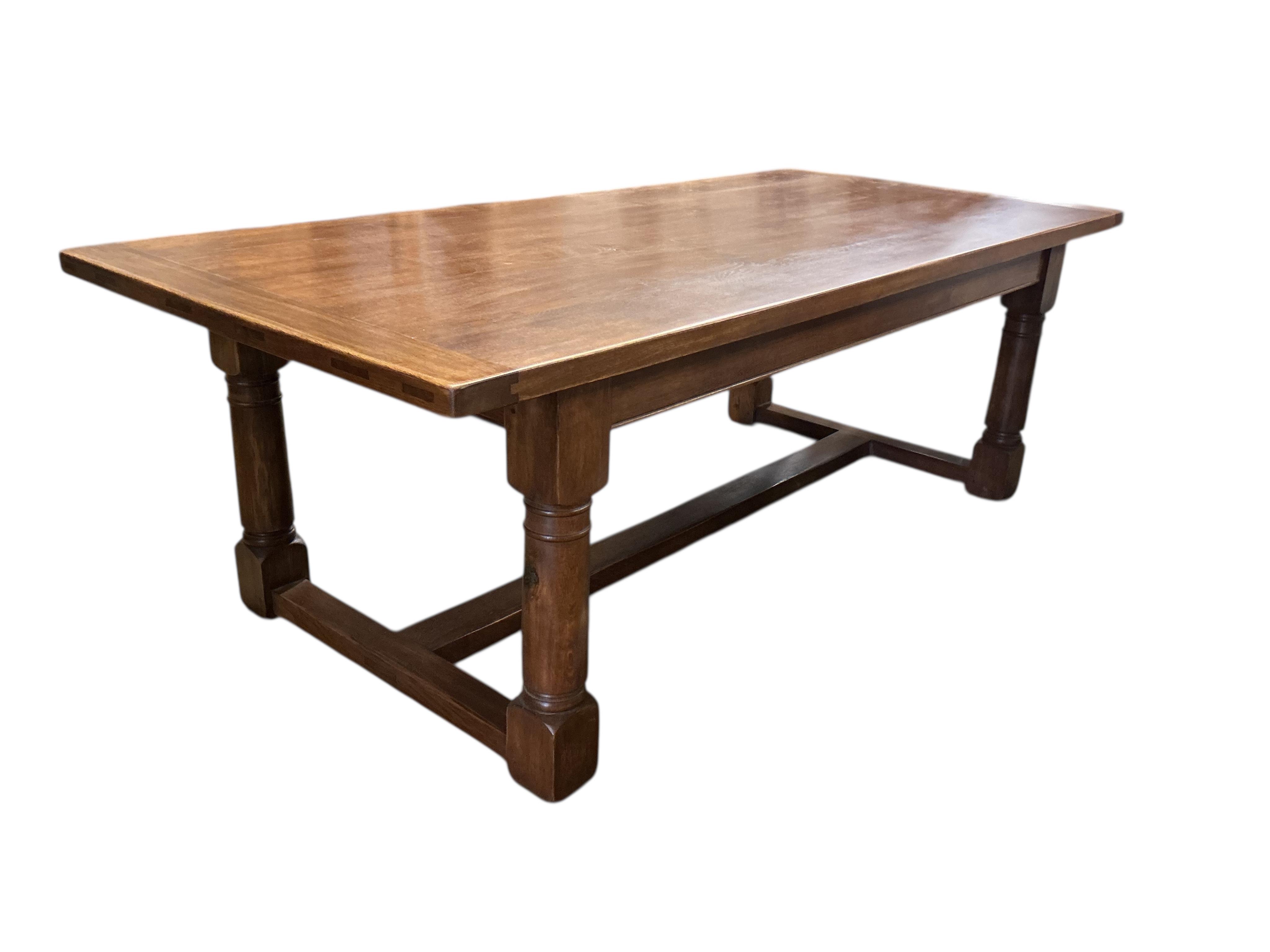 An 18th century style rectangular oak refectory dining table, width 229cm, depth 107cm, height 78cm
